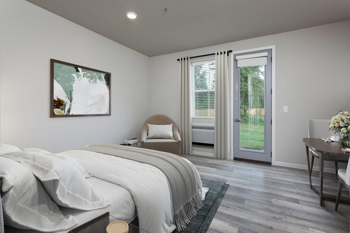 Modern bedroom with elegant decor, featuring a cozy bed, abstract art, and a scenic garden view through a glass door.